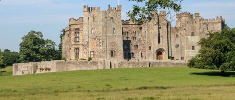 A large, historic castle with multiple towers and a prominent entrance.