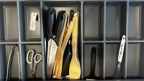 A kitchen drawer with various utensils including scissors, a whisk, and wooden spoons. - Captivating 2-bed Apartment in Viby J (Aarhus)