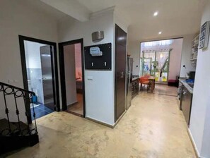 Enjoy meals in the spacious dining area with a table and chairs, and access to a balcony with a view.