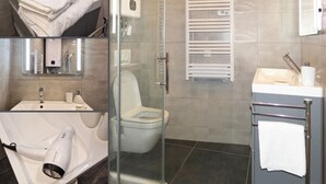 A modern bathroom with a glass shower enclosure, a toilet, and a sink with a towel rack. - 􏰇􏰅􏰱􏰂􏰄􏰎􏱂􏰳􏱃 􏰄􏰁􏰁􏰂􏰅􏰇􏰁􏱂􏰃􏱃appartement Dans le Centre Historique (Lourdes)