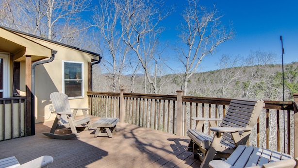 A wooden deck with lounge chairs and a table, surrounded by a wooden fence, with trees and hills in the background. - 8 Mi to Lake Lure! Mtn-View Gem w/ Furnished Deck (Rutherfordton)