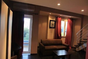 Junior Suite | Minibar, laptop workspace, blackout drapes, free WiFi