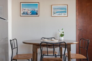 Superior Quadruple Room | Living area | 25-inch flat-screen TV with cable channels -  Sunset Paros Naousa (Paros)