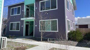 A two-story residential building with a balcony on the second floor, numbered 243. - Midtown’s Hidden Secret (Reno)