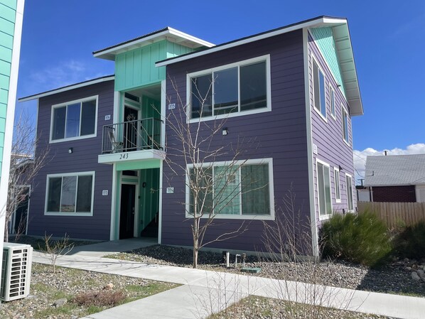 A two-story residential building with a balcony on the second floor, numbered 243. - Midtown’s Hidden Secret (Reno)
