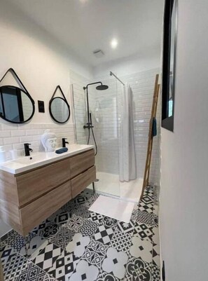 Shower, hair dryer, soap, toilet paper