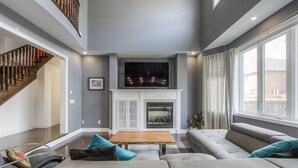 Living room - Spacious Family Haven: Modern 4-bedroom Luxury Home (Brampton)