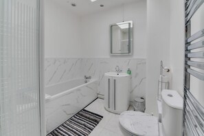 House | Bathroom | Separate tub and shower, deep soaking tub, hair dryer, towels - Remarkable 3-bed House in Middleton Manchester (Manchester)