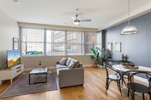 TV - NOLA Skyline Retreat: City Chic 1BR Condo with Rooftop Pool (New Orleans)