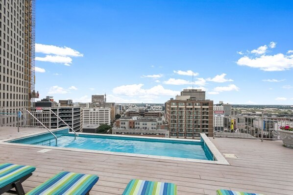 Outdoor Pool - Rooftop Reverie: Modern Elegance in 1BR Condo with BBQ Area (New Orleans)