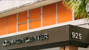 The entrance to the Canyon Center building with a sign displaying the address 925. - French Quarter Gem: Stylish 1BR Condo with Pool Oasis (New Orleans)