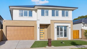 A two-story house with a garage, a front door, and a large window. - Cowes Market Oasis with private pool (Cowes)