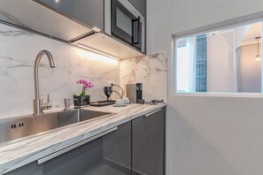 Fridge, microwave, stovetop, coffee/tea maker