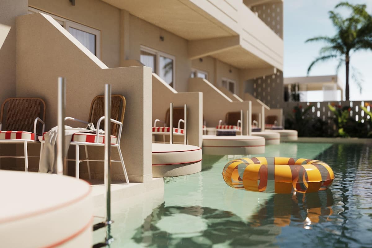 A pool area with lounge chairs and a floating ring.