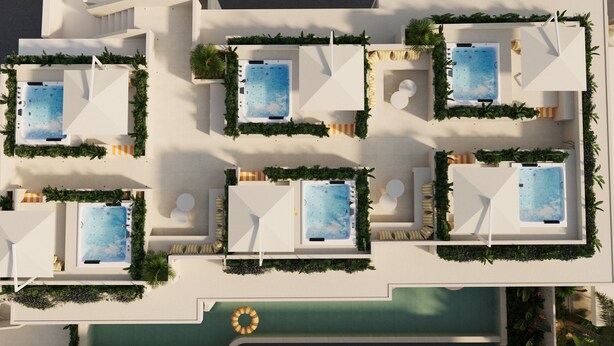 Een dakterras met een zwembad, meerdere whirlpools en ligbedden, omringd door groen.