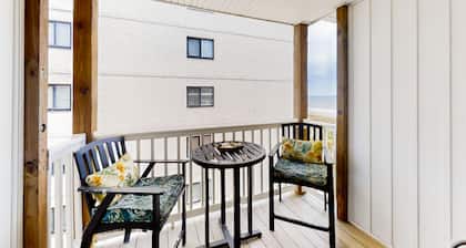 Third-floor beachfront retreat with furnished balcony, pool, washer/dryer