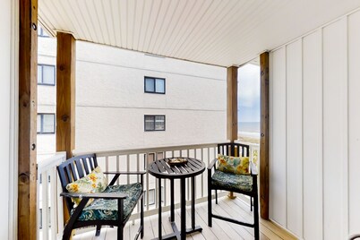 Third-floor beachfront retreat with furnished balcony, pool, washer/dryer
