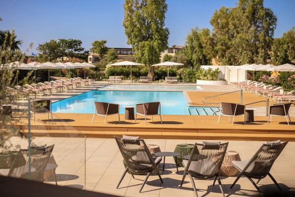 2 outdoor pools, pool umbrellas, pool loungers