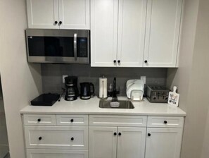 Fridge, microwave, stovetop, coffee/tea maker