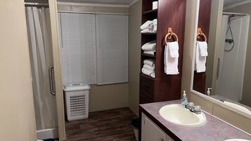 Shower, hair dryer, towels, soap