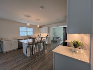 Enjoy casual dining at the central island with bar stools.
