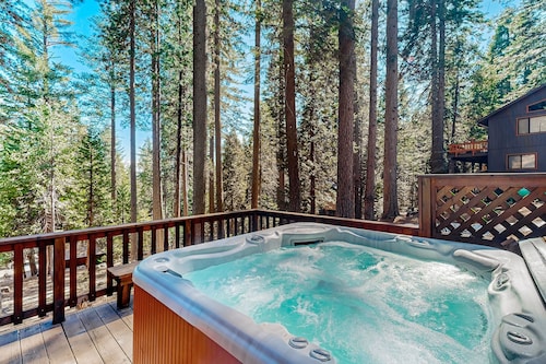 Mountain-view cabin among the trees with private hot tub, foosball, & decks