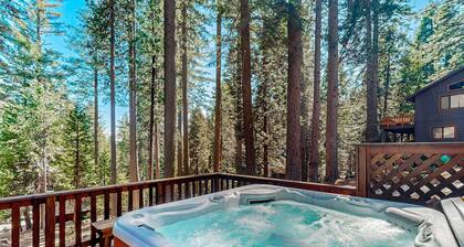 Mountain-view cabin among the trees with private hot tub, foosball, & decks
