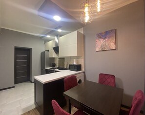 Departamento, vista a la ciudad | Cocina privada