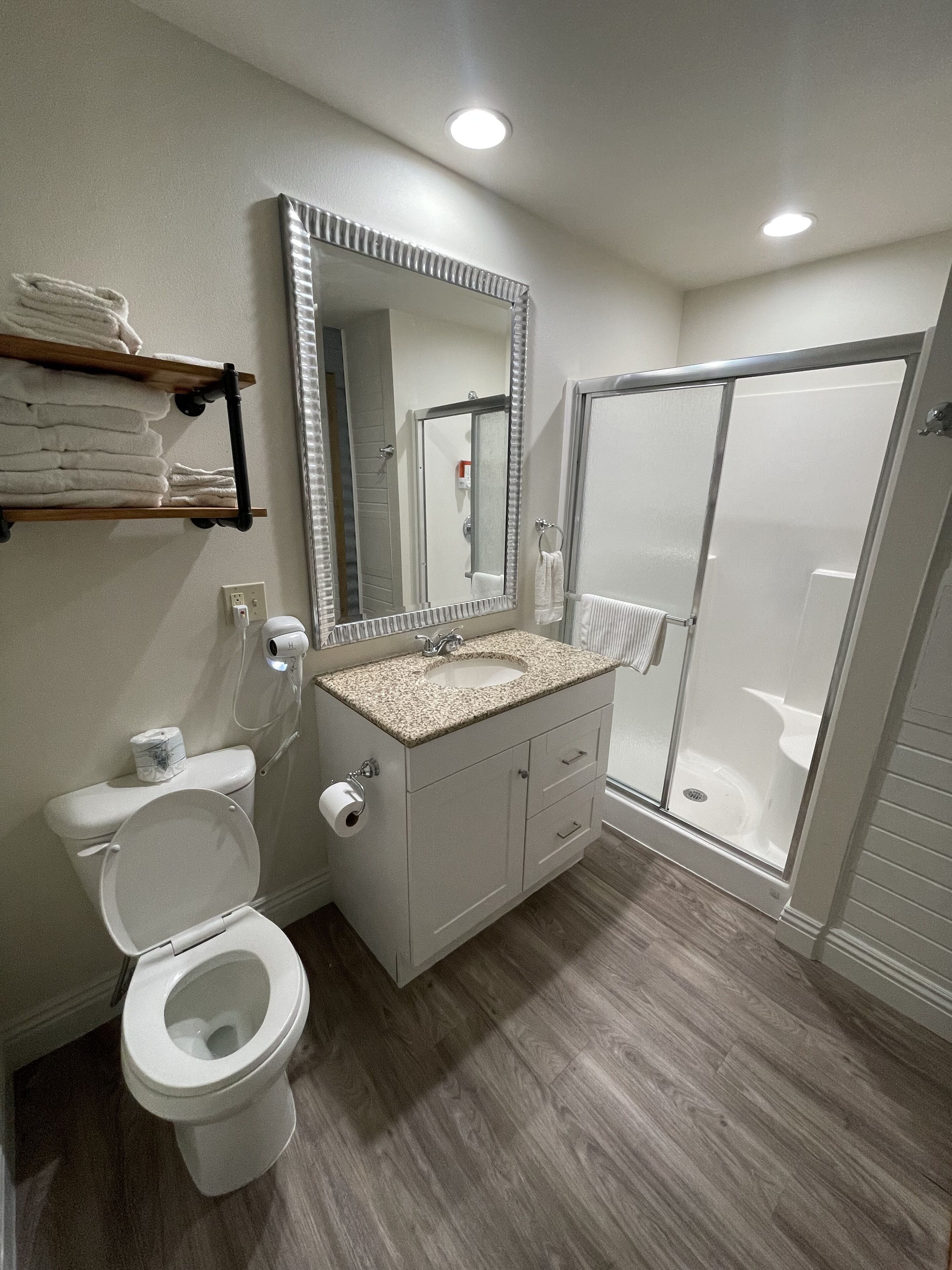 Shower, hair dryer, towels, soap