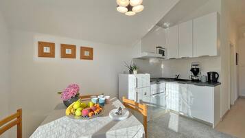 Deluxe Apartment, Balcony, Sea View | Private kitchen | Microwave, freezer