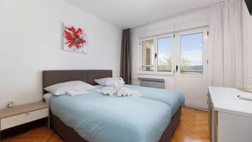 Comfort Quadruple Room, Sea View | Minibar, in-room safe, desk, laptop workspace