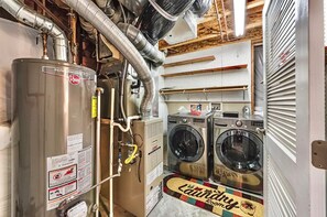 Convenient laundry facilities offer washing machines and a water heater for guest use.