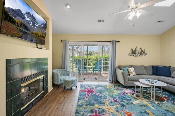 TV, fireplace - Welcome to Seashells and Sandtraps! The Perfect Oak Island Home w/ Golf Cart!  (Caswell Beach)