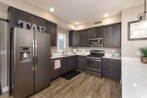Coffee/tea maker, fridge, microwave, oven
