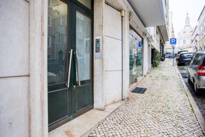 Stunning building facade with a modern entrance and parking available.