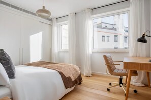 Enjoy a city view from the large window in this stylish room with a comfortable bed and a desk for work.