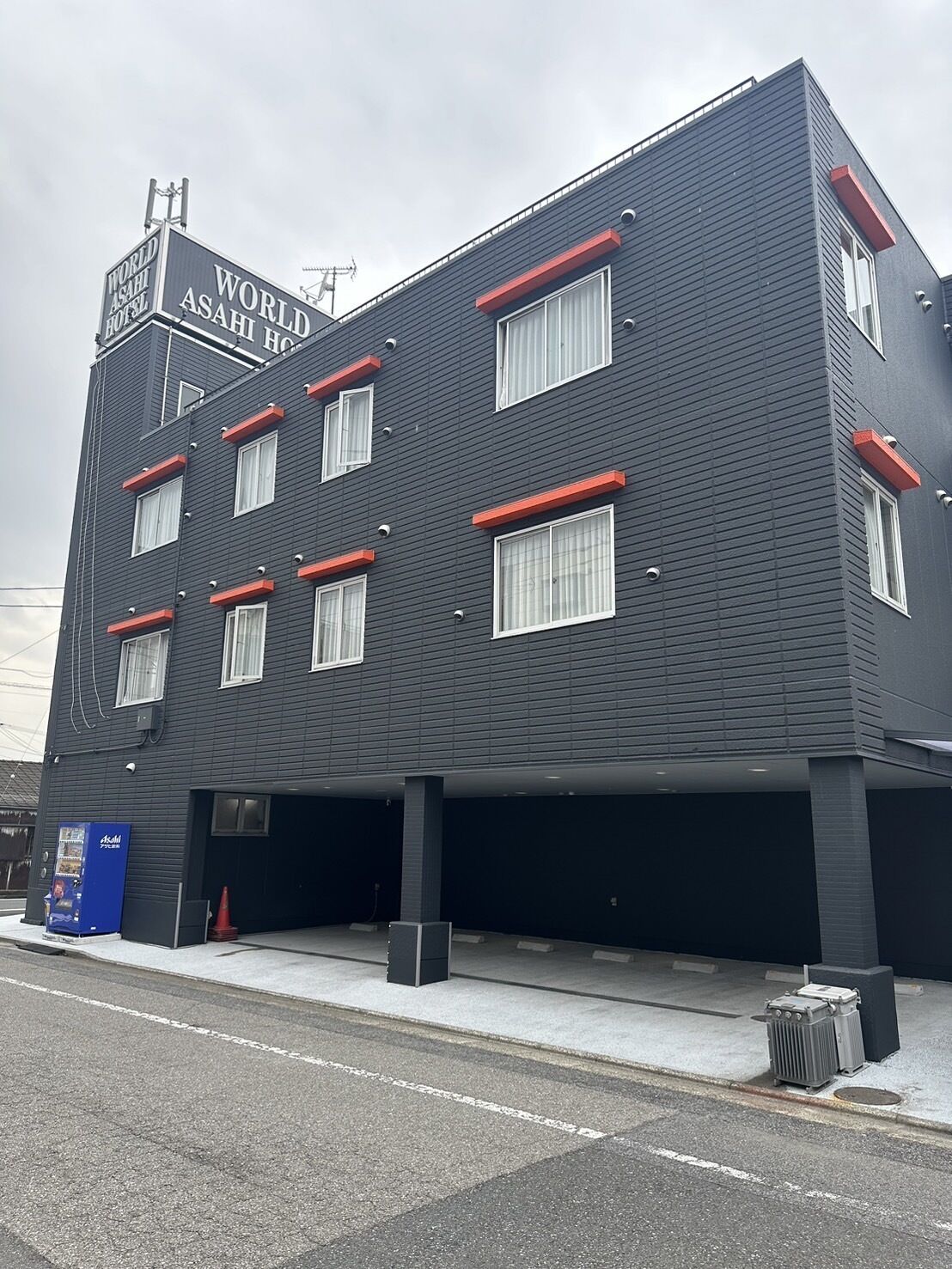 A modern building with a sign reading "World Asahi Hotel".
