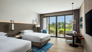 A modern hotel room with two beds, a dining table, and a balcony with outdoor seating. - Khao Lak Marriott Beach Resort and Spa  (Takua Pa)