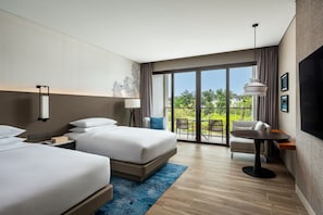 A modern hotel room with two beds, a dining table, and a balcony with outdoor seating. - Khao Lak Marriott Beach Resort and Spa  (Takua Pa)