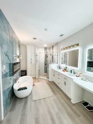Shower, jetted tub, towels, soap