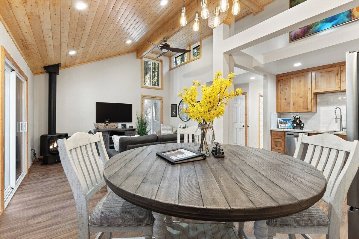 A modern kitchen with wooden cabinets, a built-in oven, and a refrigerator.