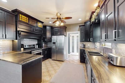 Dog-friendly countryside home with firepit, wraparound porch, & prime stargazing