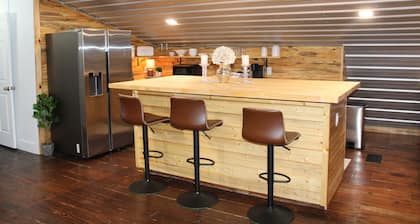 Charming barn nestled in a picturesque farm setting meets farmhouse elegance