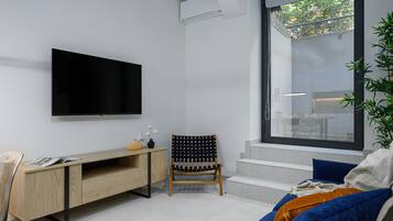 Habitació urbana | Sala d'estar | Televisor LED, Netflix i serveis de streaming