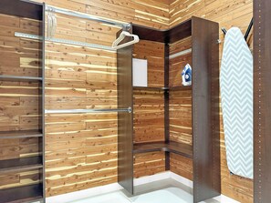 A shower area with wooden paneling, a towel rack, and a shower curtain. - Stunning Modern Oasis - Private Heated Pool & Spa · Mtn Views · 5min to Downtown (Palm Springs)
