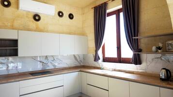 Family House, Multiple Bedrooms (Nirvana Gozitan Villa & Pool) | Private kitchen | Fridge, microwave, oven, stovetop