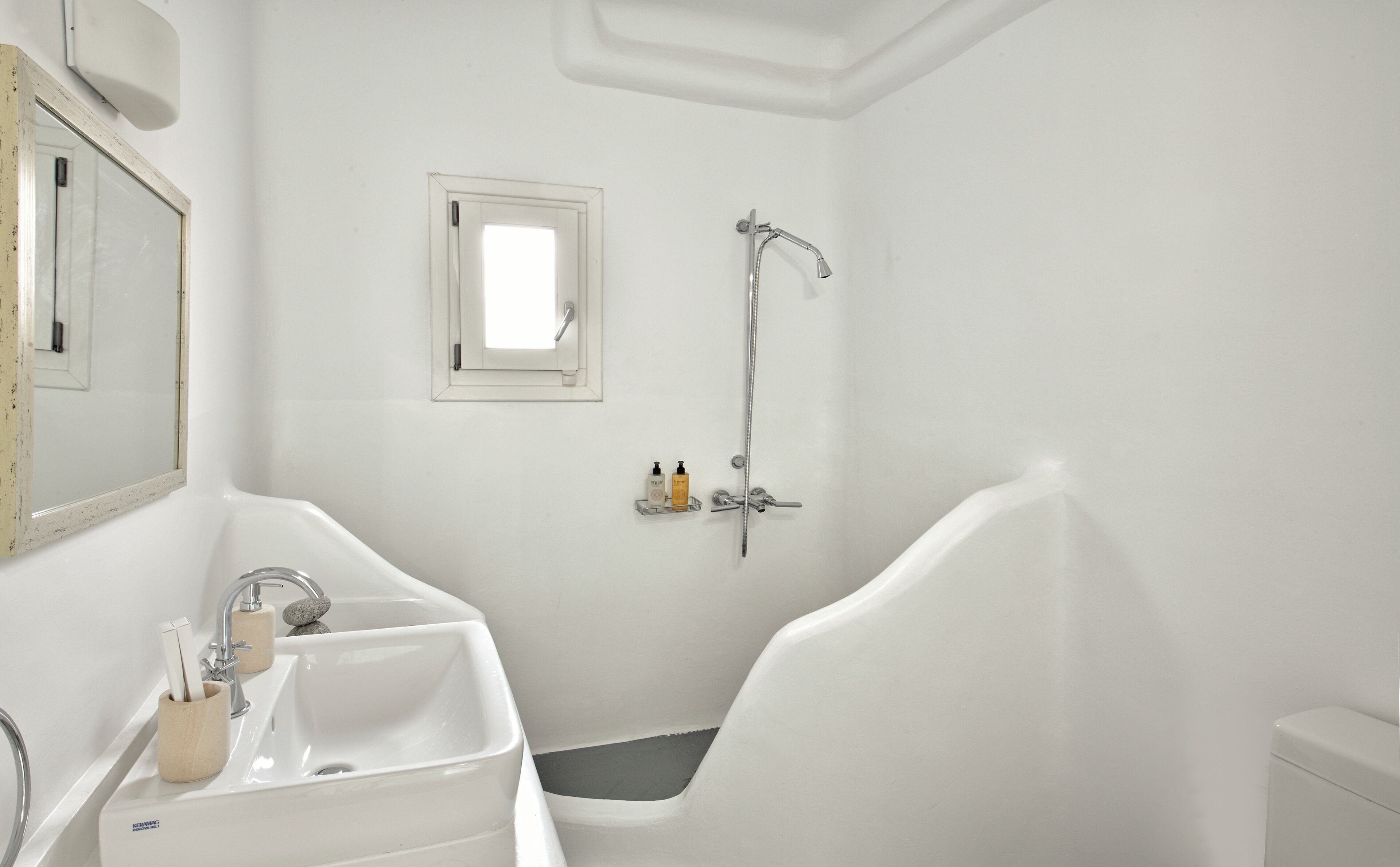 A bathroom with a bathtub, a sink, and a shower.