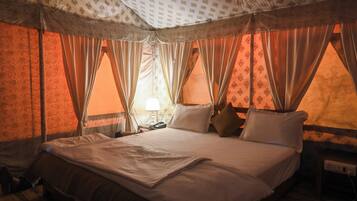 Deluxe Tent | Premium bedding, down duvets, memory-foam beds, desk