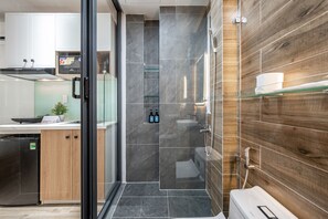 Economy Studio | Bathroom | Shower, hair dryer, bathrobes, slippers - Cozrum Home - Daisy House (Ho Chi Minh City)
