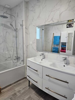 Shower, hair dryer, towels, soap